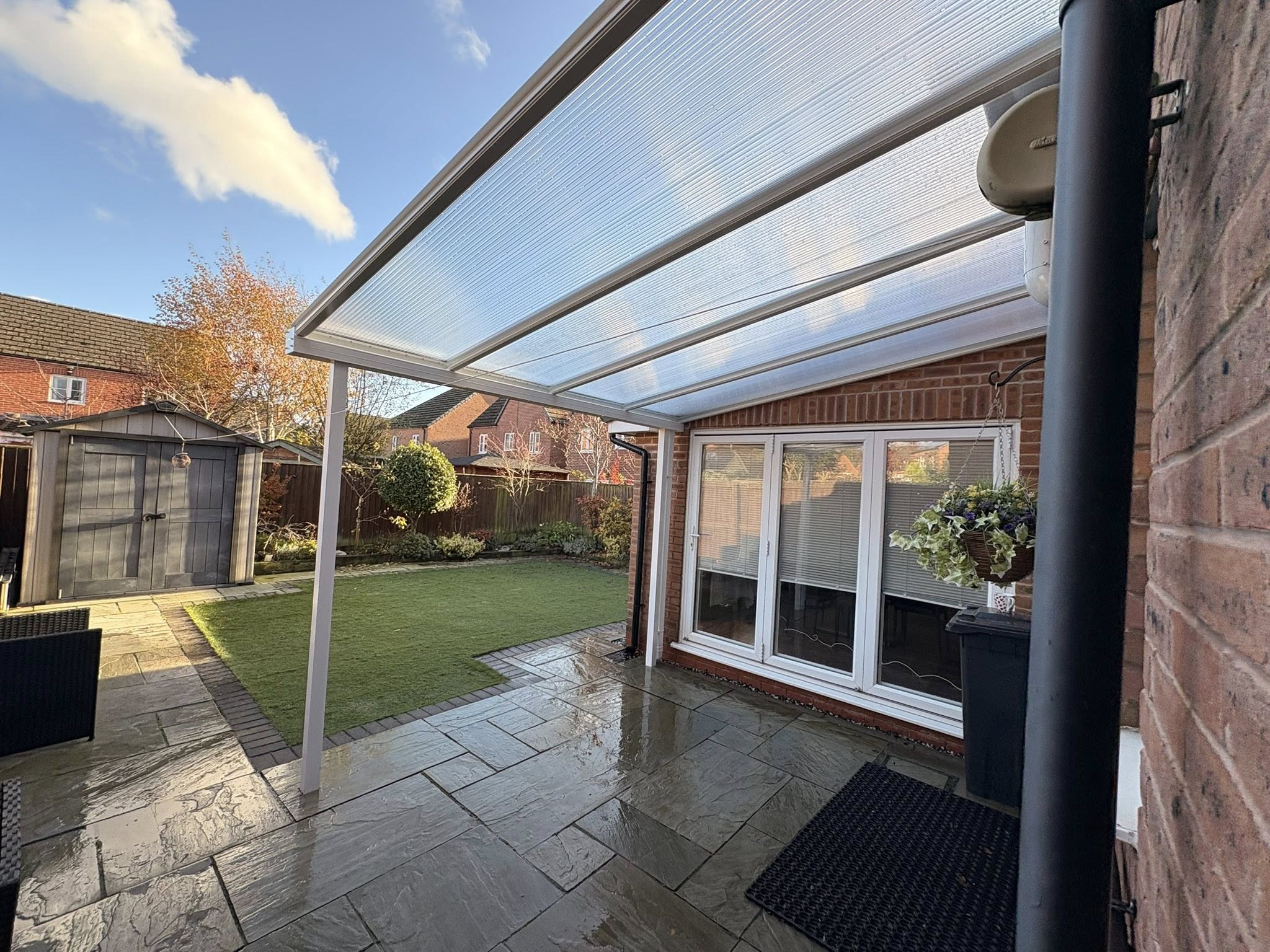 Canopy installed on the corner of a house